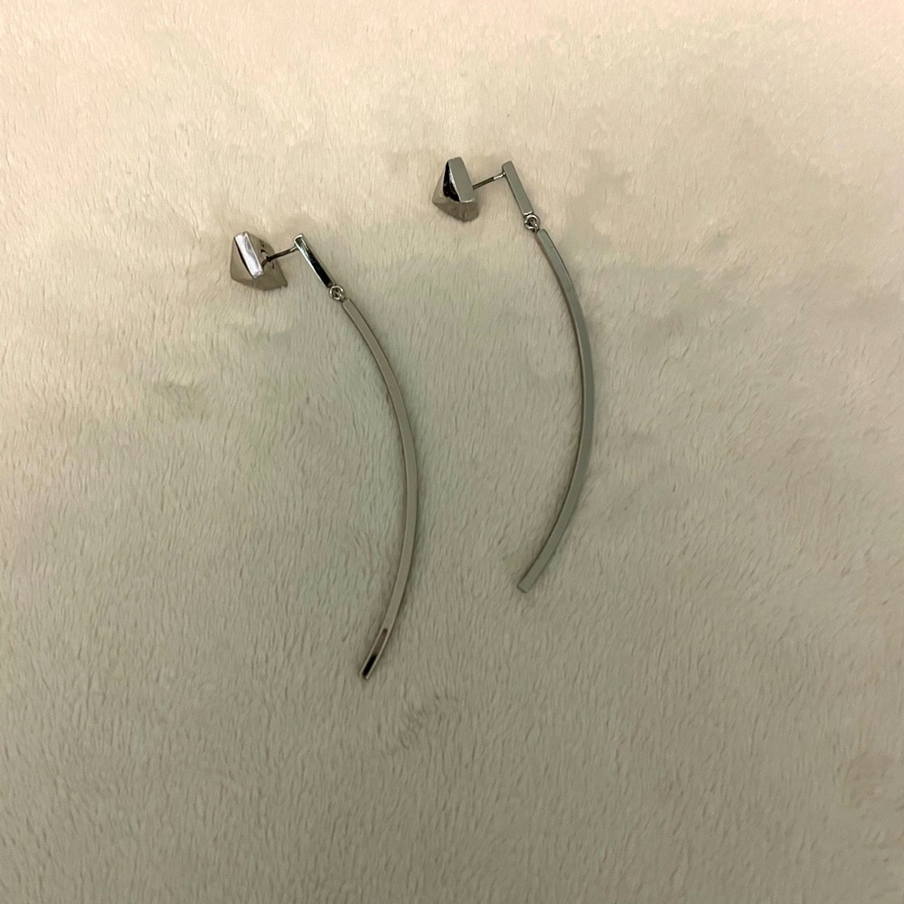 Unique silver tone long curved earrings